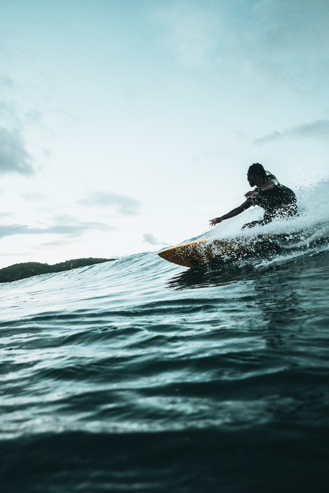 girl surfing in Indonesia 